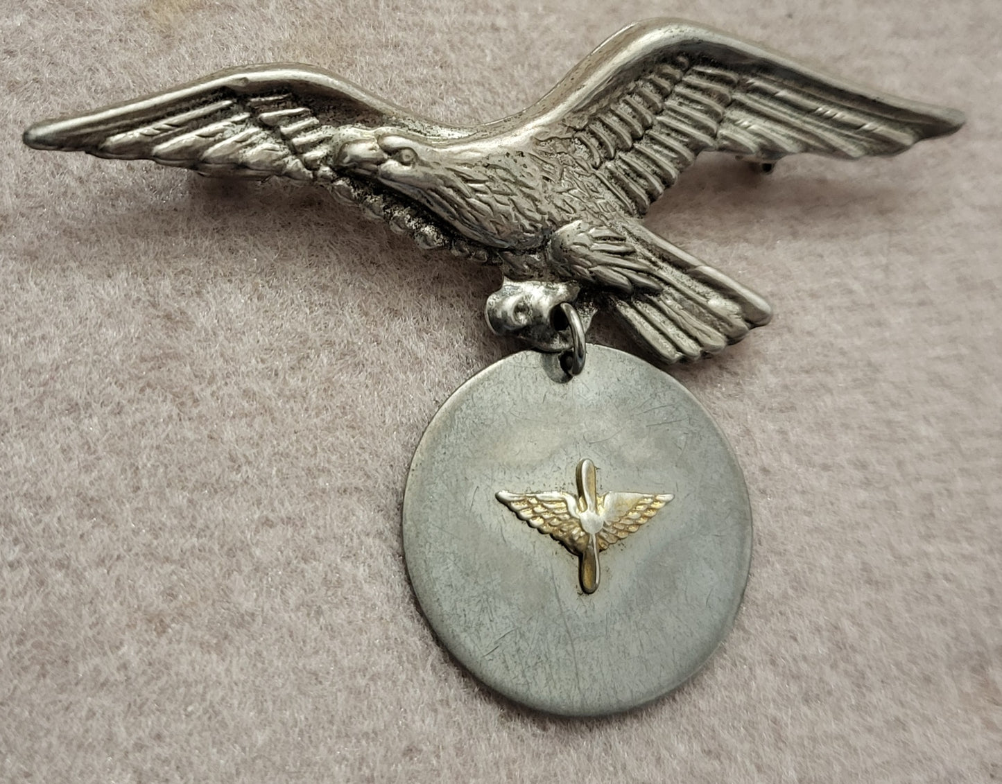 Vintage WW2 Sterling Silver Egale Pin Holding Pendant with Propeller Wings