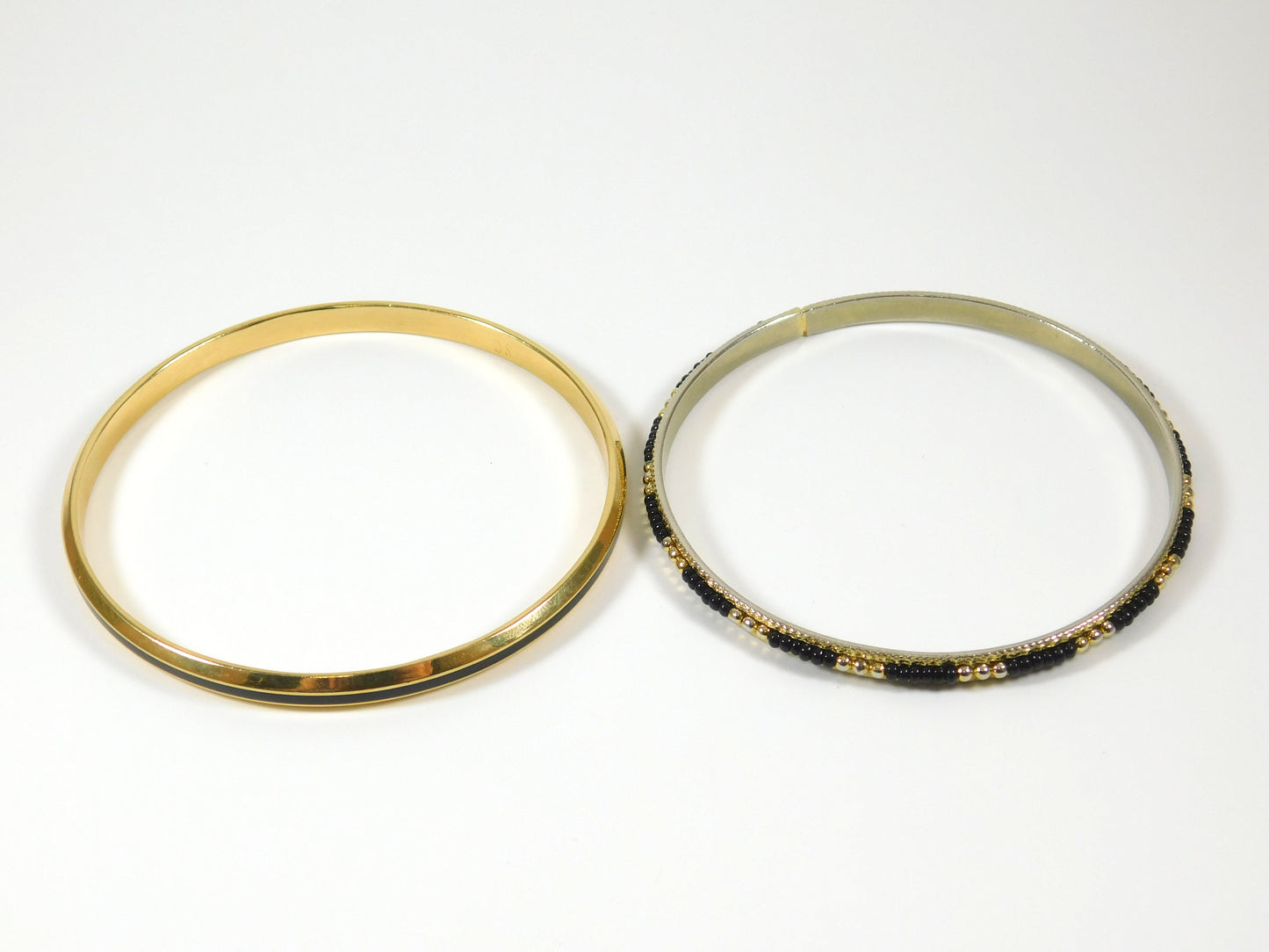 2 Black and Gold Tone Bangle Bracelets