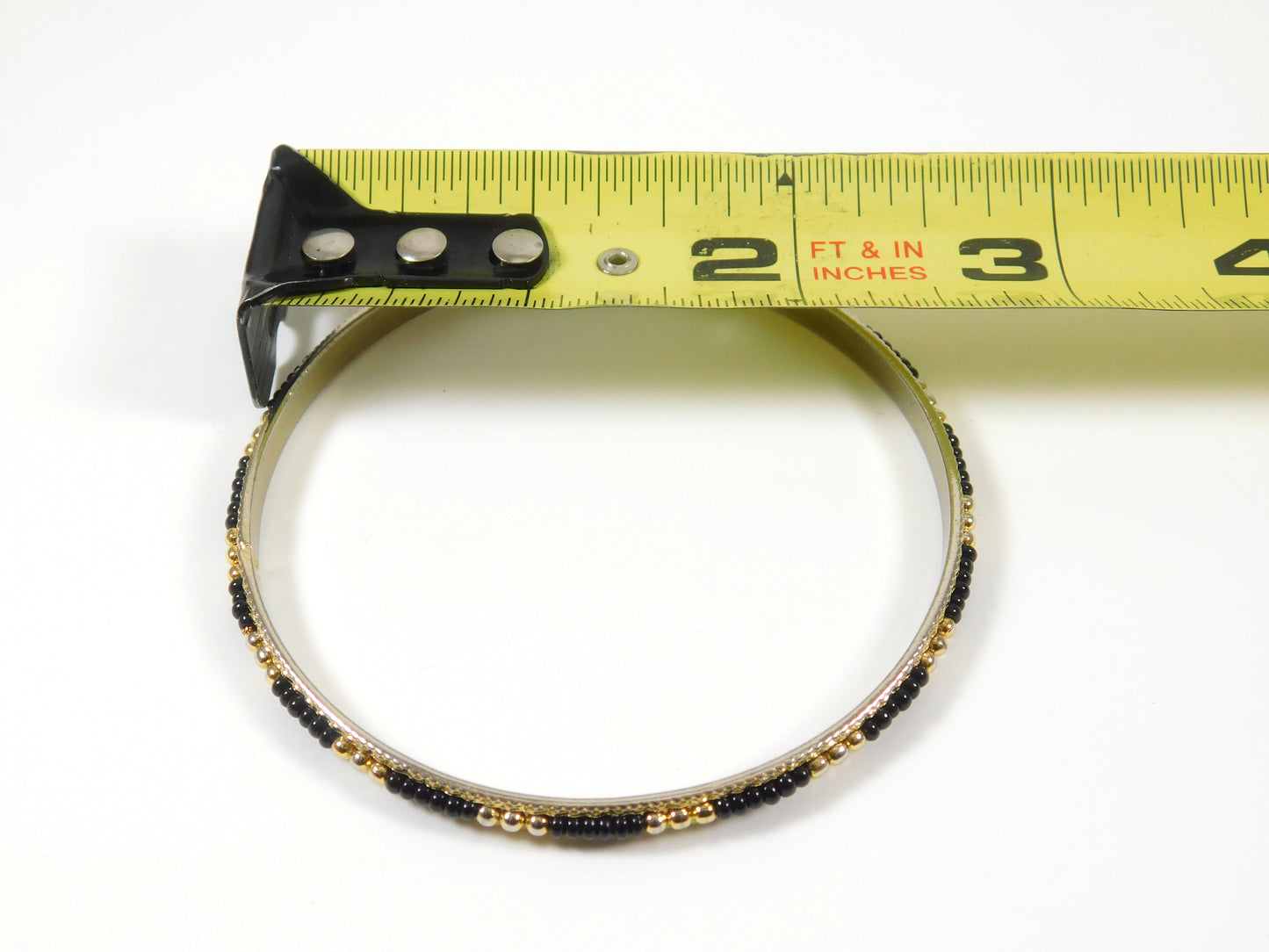 2 Black and Gold Tone Bangle Bracelets