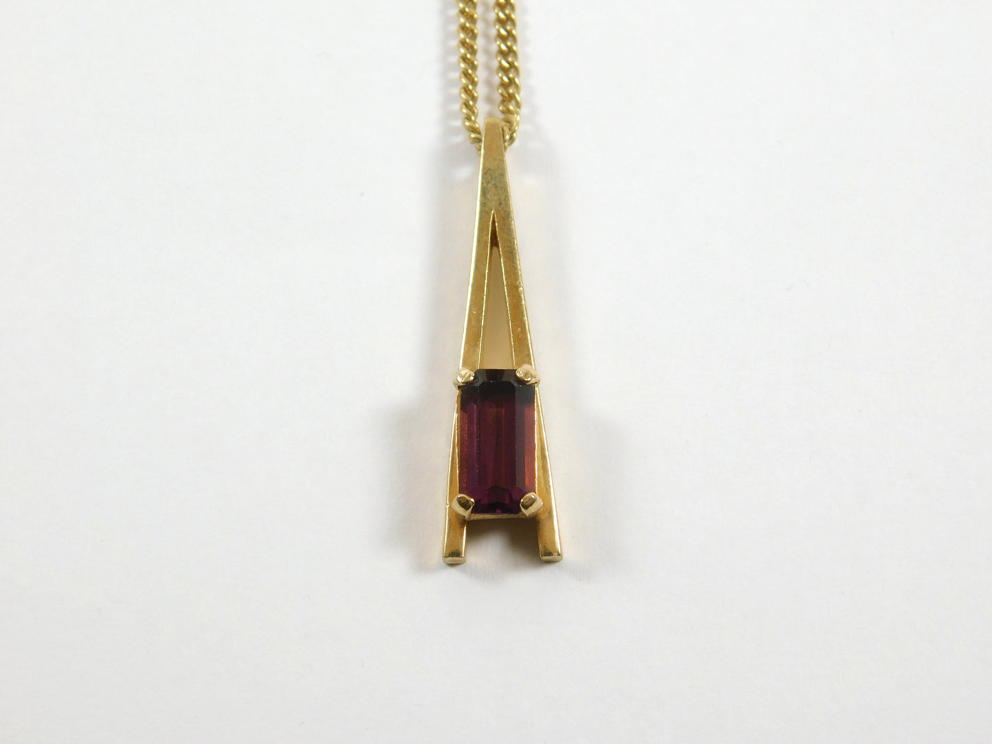 Vintage Avon Gold Tone "A" Shaped Necklace with Rectangular Purple Gem