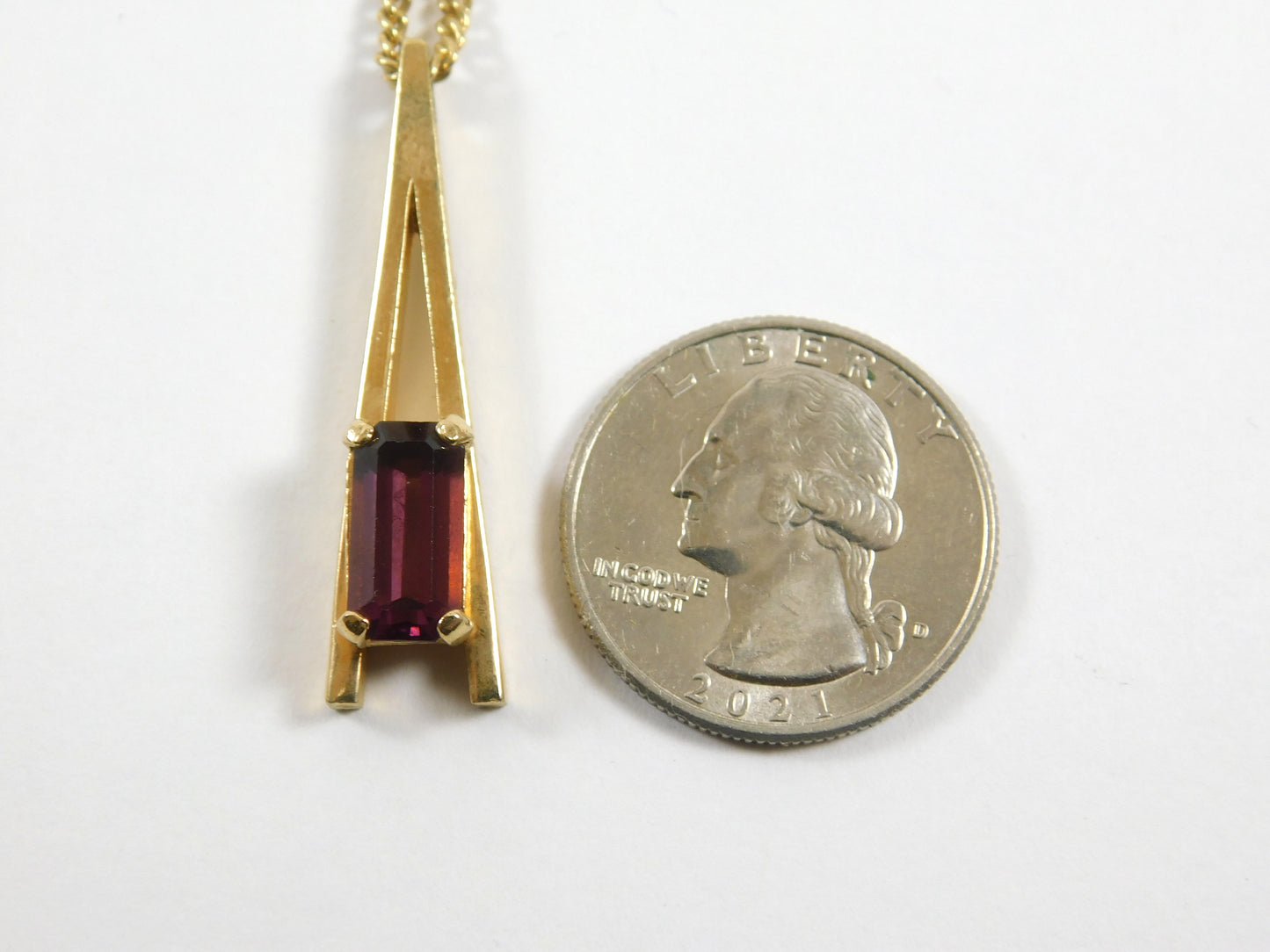 Vintage Avon Gold Tone "A" Shaped Necklace with Rectangular Purple Gem