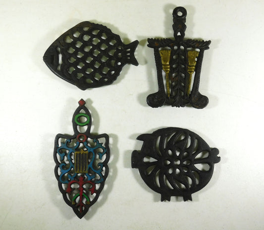 Four Vintage Cast Iron Metal Trivets - Fish, Spade, Pig, Brooms
