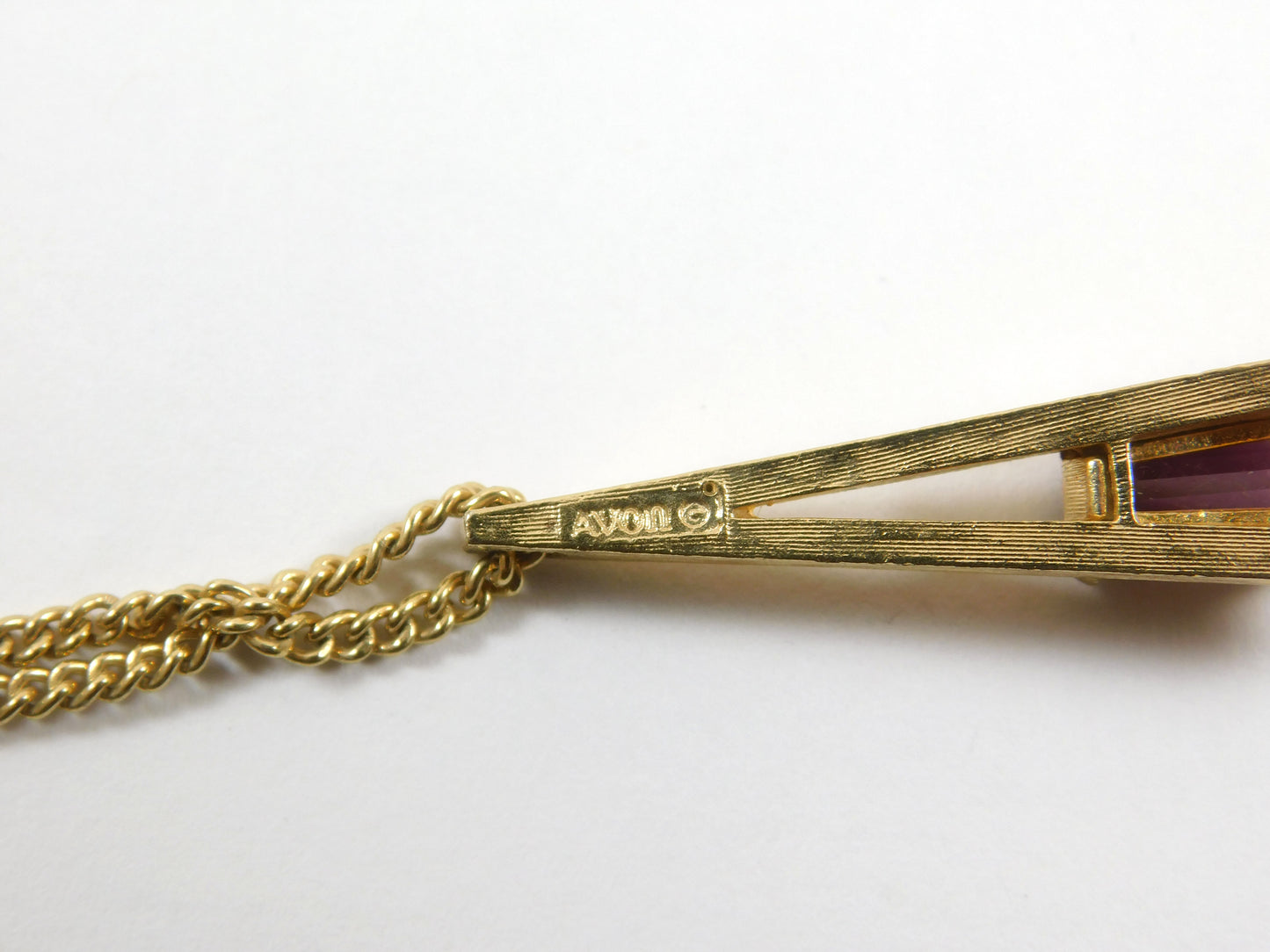 Vintage Avon Gold Tone "A" Shaped Necklace with Rectangular Purple Gem