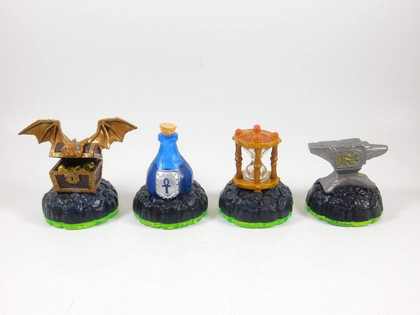 4 Skylanders Figures Hidden Treasure, Healing Elixir, Time Twister, Anvil Rain