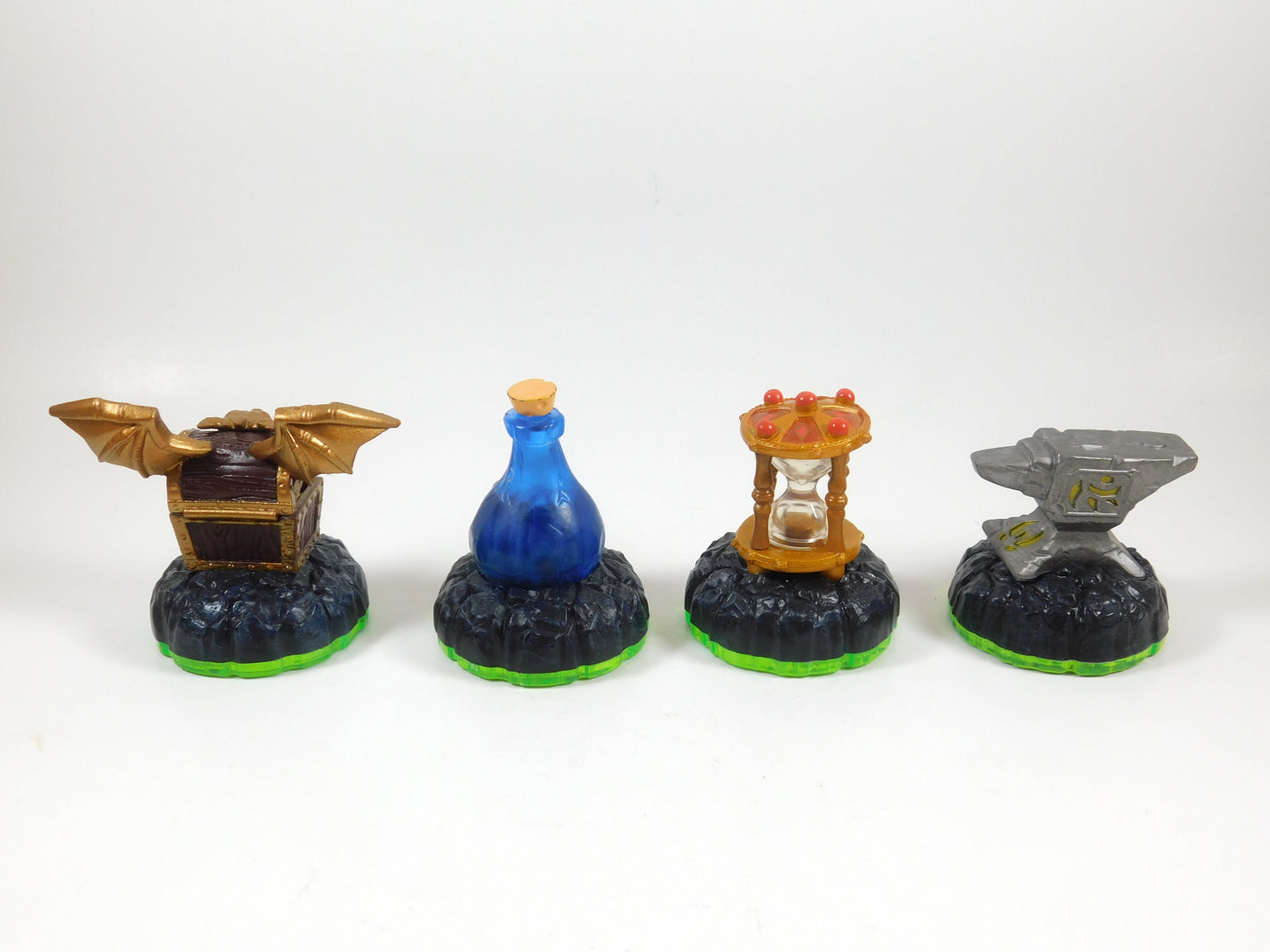 4 Skylanders Figures Hidden Treasure, Healing Elixir, Time Twister, Anvil Rain